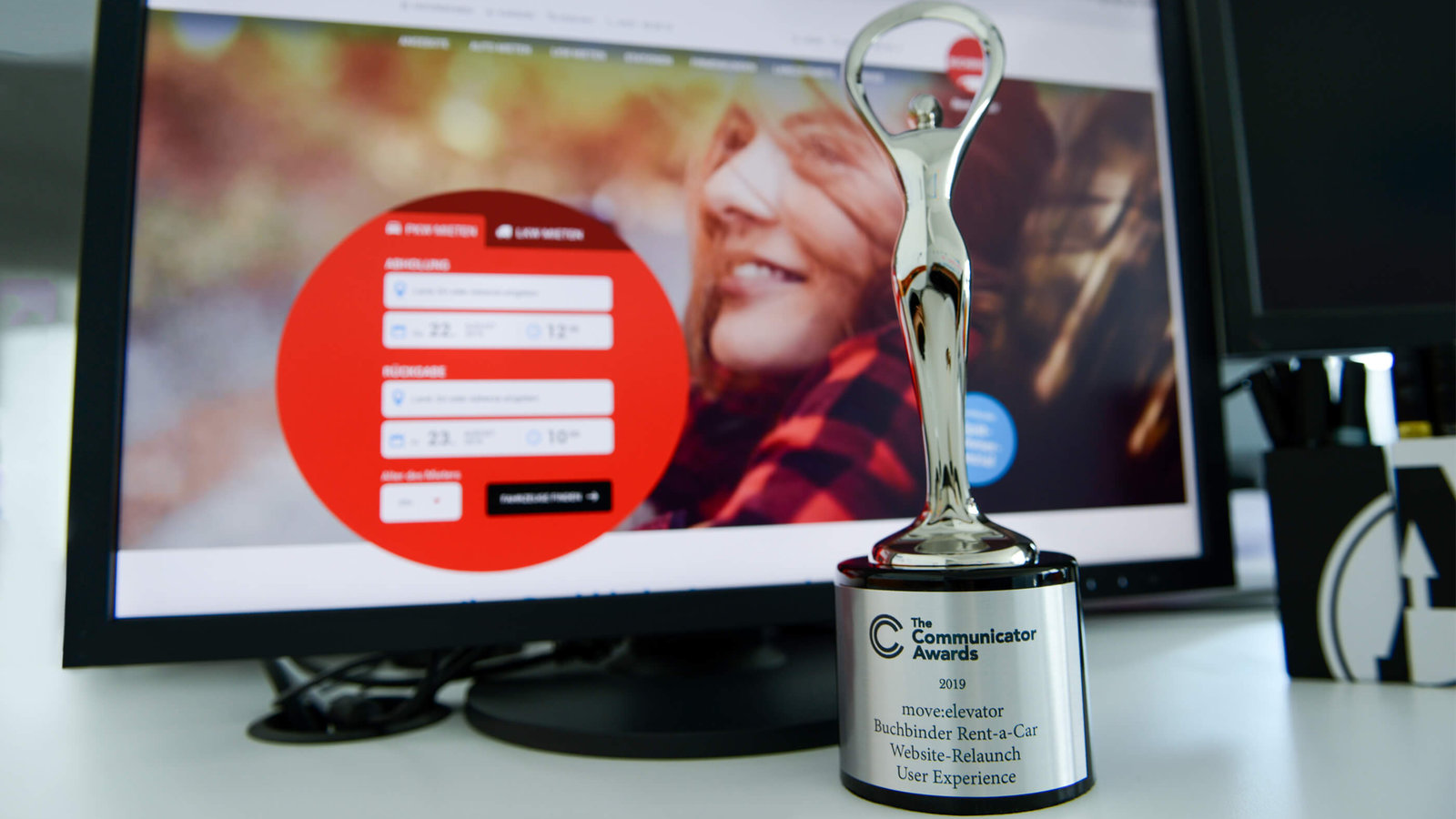 Screenshot Buchbinder Website und Communicator Award (silber)